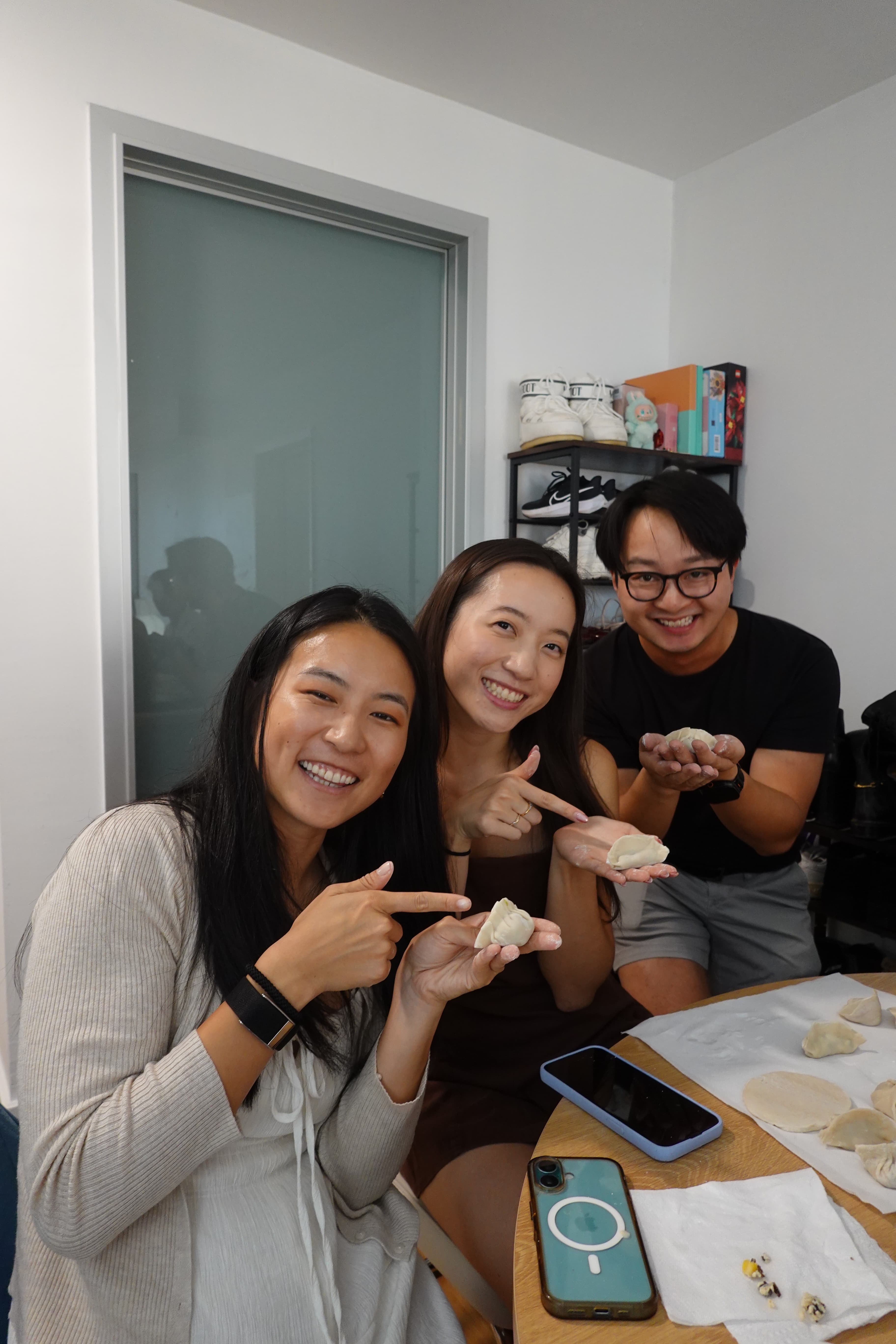 Friends showing their handmade dumplings